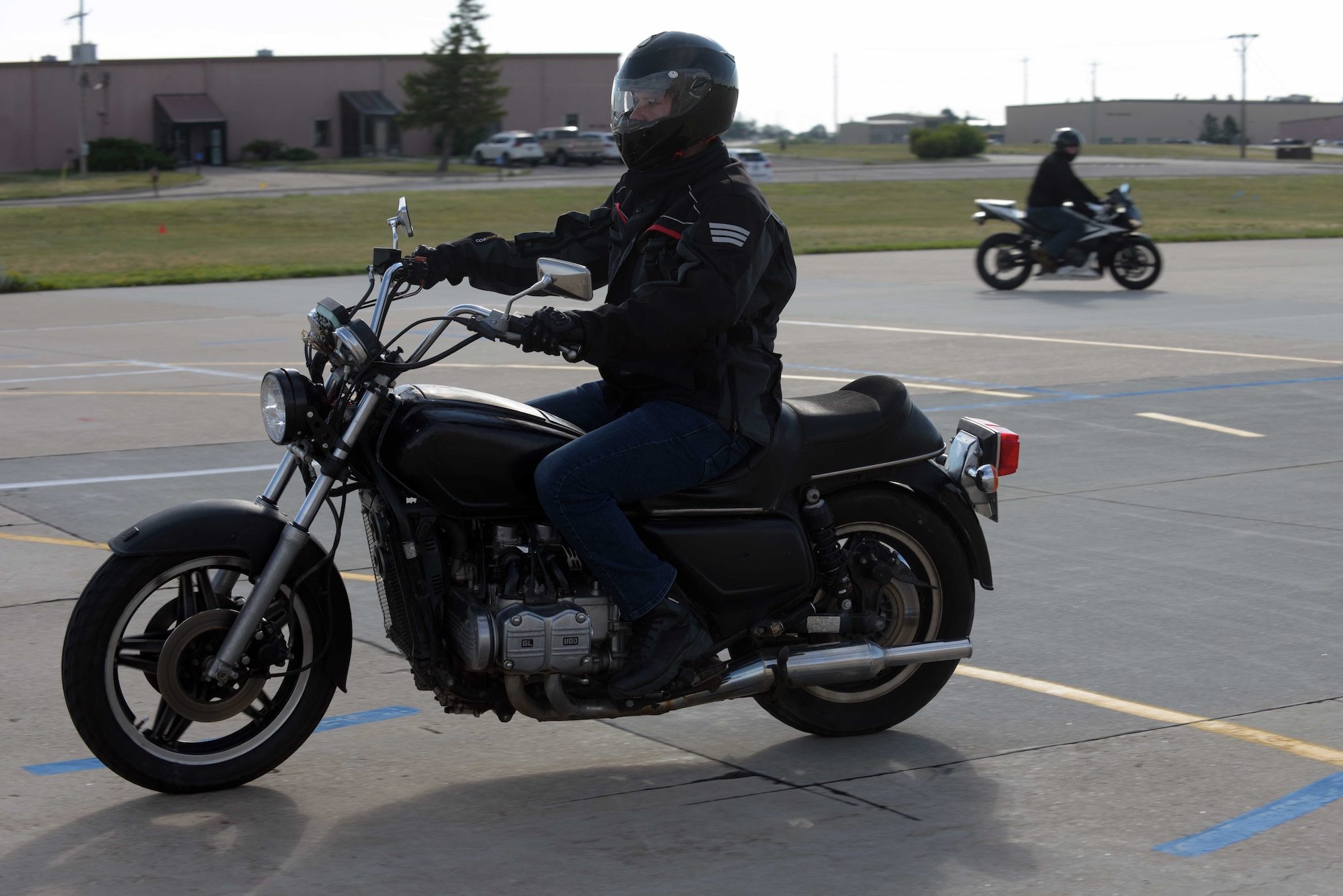 Airmen Assigned to the 28th Bomb Wing performs motorcycle maneuver.
