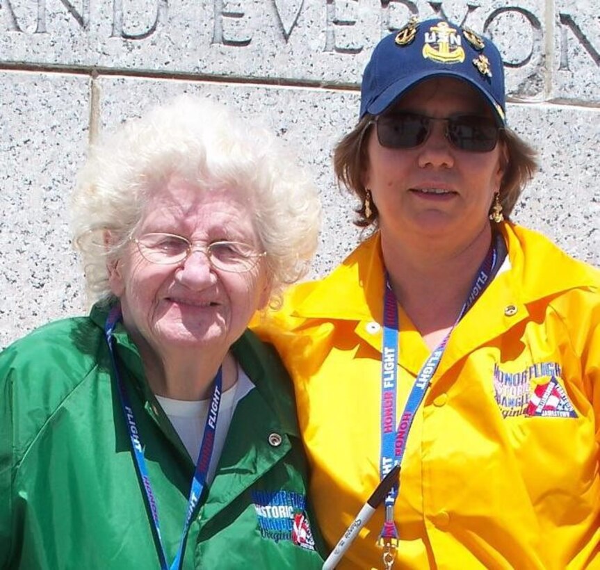 DIA Officer April Maletz (right) stands with WWII Navy veteran Alice Wamsley during an Old Dominion Honor Flight mission. Maletz is a 2020 recipient of the Spirit of Bob Hope Award for her work serving veterans.