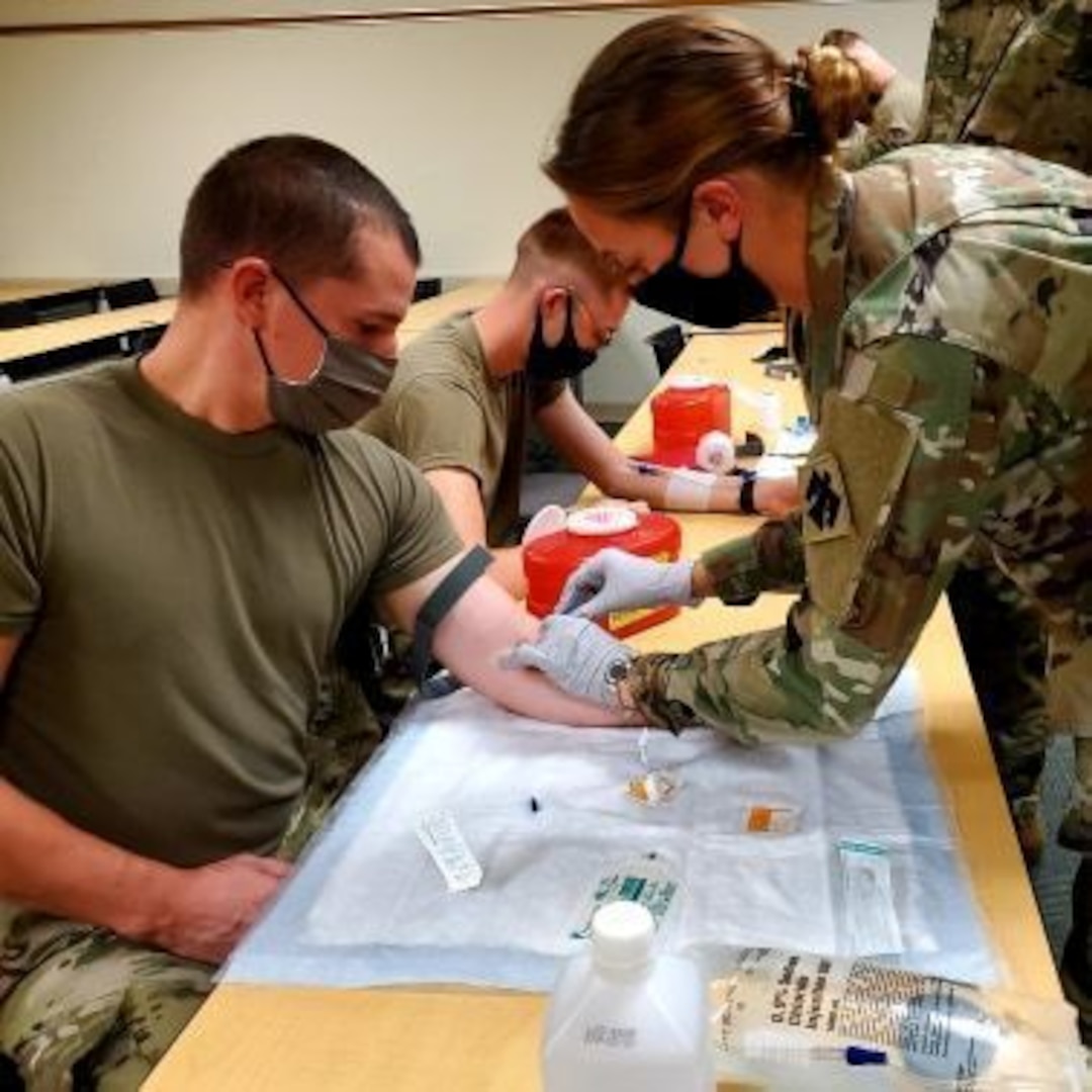 Soldiers from the 700th Brigade Support Battalion, 45th Infantry Brigade Combat Team, practice drawing blood during their annual training at the Norman Armed Forces Reserve Center in Norman, Oklahoma.

The Soldiers are wearing masks as a COVID-19 countermeasure whenever social distancing is not possible. (courtesy photo provided by Cpt. Jordan Bennett)