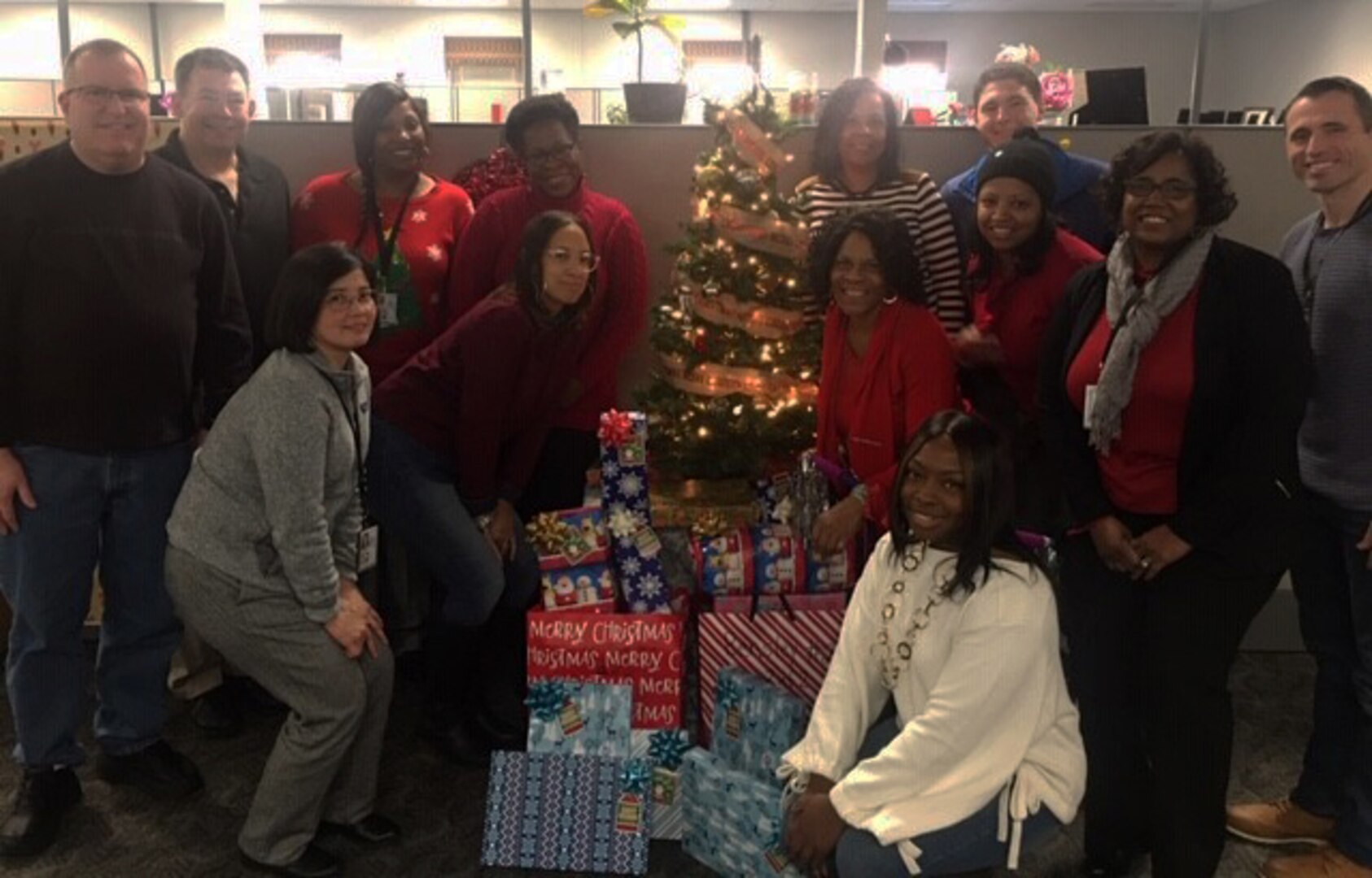Sean Shockley poses with team members and Angel Tree gifts they collected in 2019