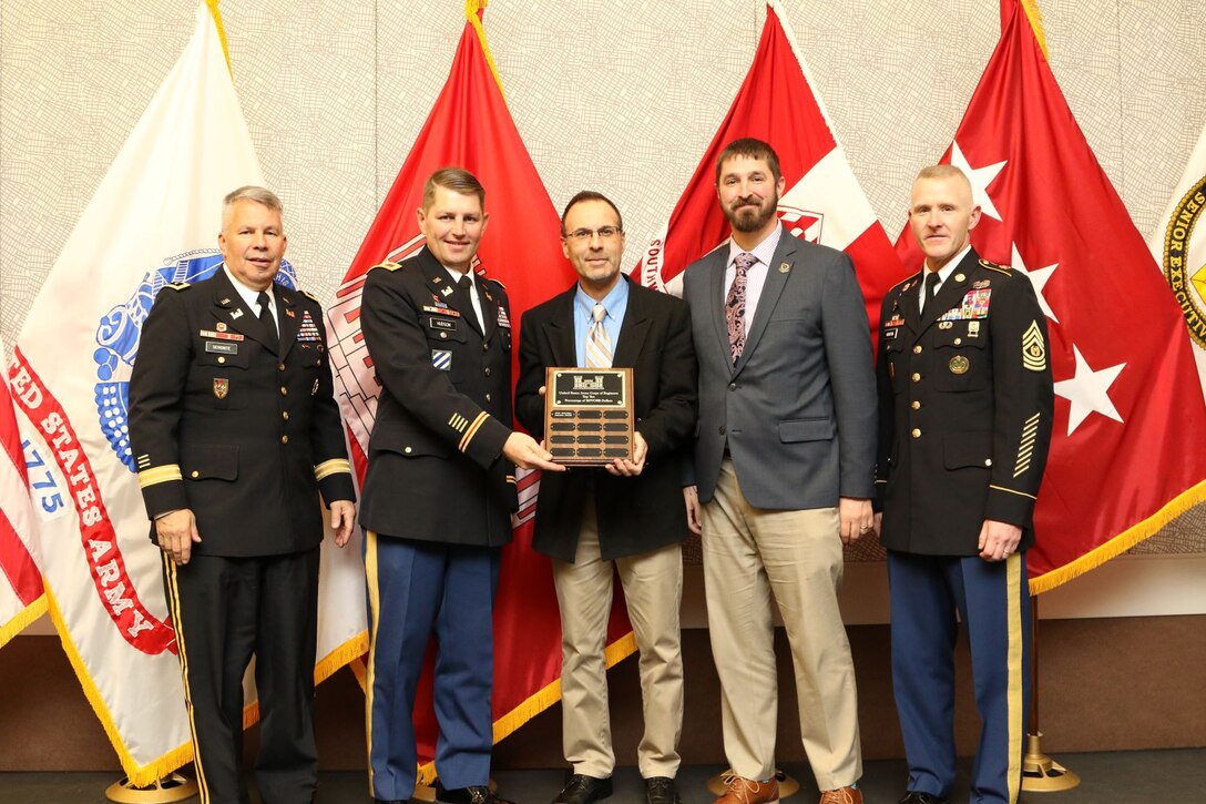 Daniel Curado (center), small business program chief, U.S. Army Corps of Engineers, Omaha District, and Matt Hibbert, small business program specialist, receive a HQ USACE award from Col. John Hudson, former district commander, for dollars obligated to the service disabled veteran owned small business program in 2019.  Lt. Gen. Todd Semonite, USACE Commander (left) and former USACE Command Sgt. Maj. Bradley Houston were in attendance. (Courtesy photo)