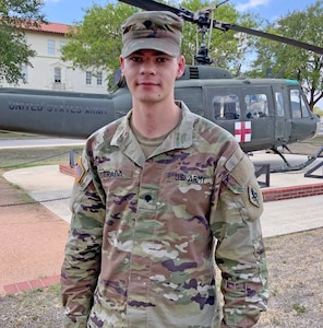 Spc. Jesse Estrada, pictured in front of the U.S. Army Medical Center of Excellence, or MEDCoE, headquarters building at Joint Base San Antonio-Fort Sam Houston, represented the Soldier category during the U.S. Army Training and Doctrine Command 2020 Best Warrior virtual oral board Aug. 25.