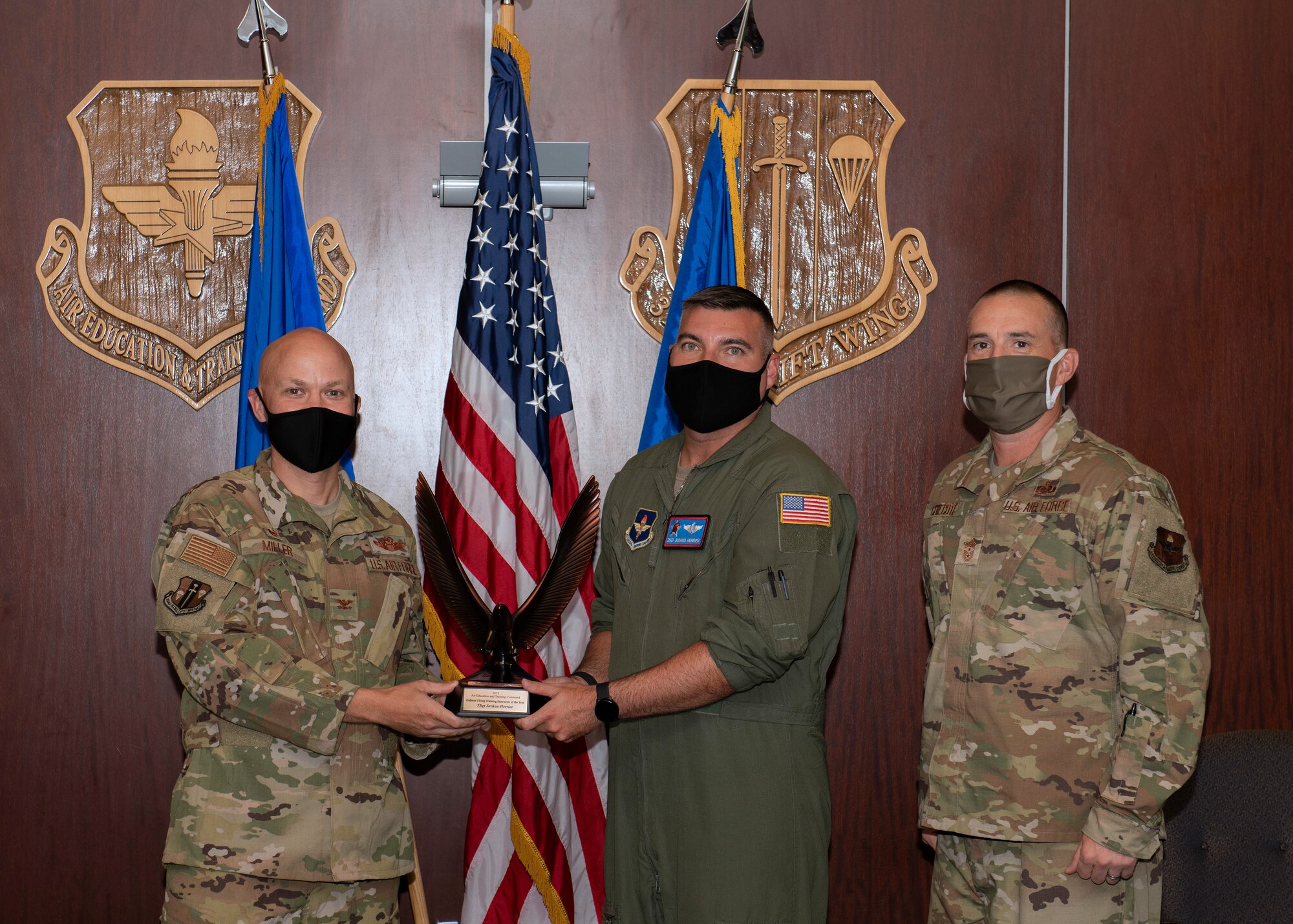 An Airman receives an award