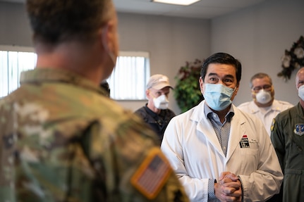 Dr. Martin Bautista, a physician at the Memorial Hospital of Texas County in Guymon, Oklahoma, welcomes members of the Oklahoma Army and Air National Guard, Centers for Disease Control and Prevention, the Oklahoma State Department of Health, Oklahoma State University laboratories, and the Federal Emergency Management Agency, during a visit to the hospital, May 15, 2020. As of May 19, 2020, Guymon had 650 confirmed cases of COVID-19, making it second in the total number of cases in Oklahoma. Oklahoma City, which has the highest number of COVID-19 cases, has the largest population of any city in Oklahoma, Guymon is 40th. Beginning at the Memorial Hospital of Texas County, which has been seeing an average of three to four COVID-19 patients a day, and then moving on to the Texas County Health Department and the Seaboard Foods pork processing plant, the group focused on creating solutions to issues such as facility layouts, and supply, resources, and staffing shortages. (Oklahoma Air National Guard photo by Tech. Sgt. Kasey M. Phipps)