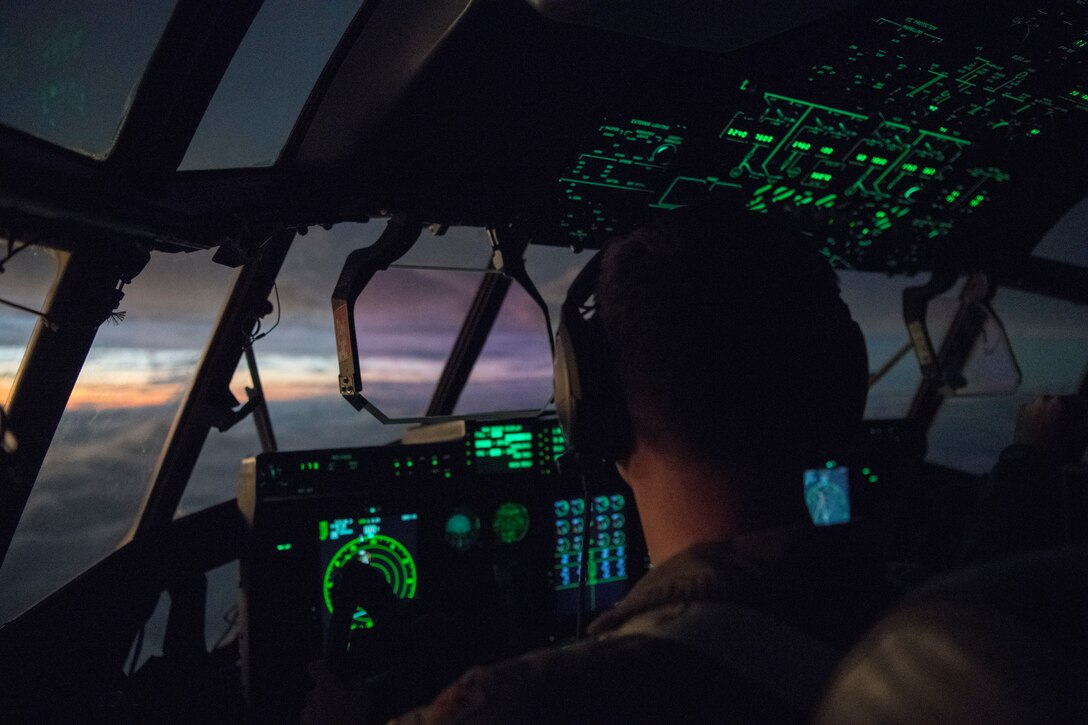 Maj. David Gentile, WC-130J pilot for the 53rd Weather Reconnaissance Squadron, flies towards the sunset after a pass through Hurricane Laura from Charleston International Airport, S.C. Aug. 25, 2020. The 53rd WRS operates out of Keesler Air Force Base, Miss., and plays an important role in the forecasting of tropical systems by flying directly into storms and collecting atmospheric data satellites cannot reach, improving the area of impact forecast by up to 25 percent. (U.S. Air Force photo by Senior Airman Kristen Pittman)