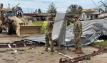 As the sun rises over Southwest Louisiana Aug. 27, 2020, members of the Louisiana National Guard clear roadways in Lake Charles and begin to assess the damage from Hurricane Laura.