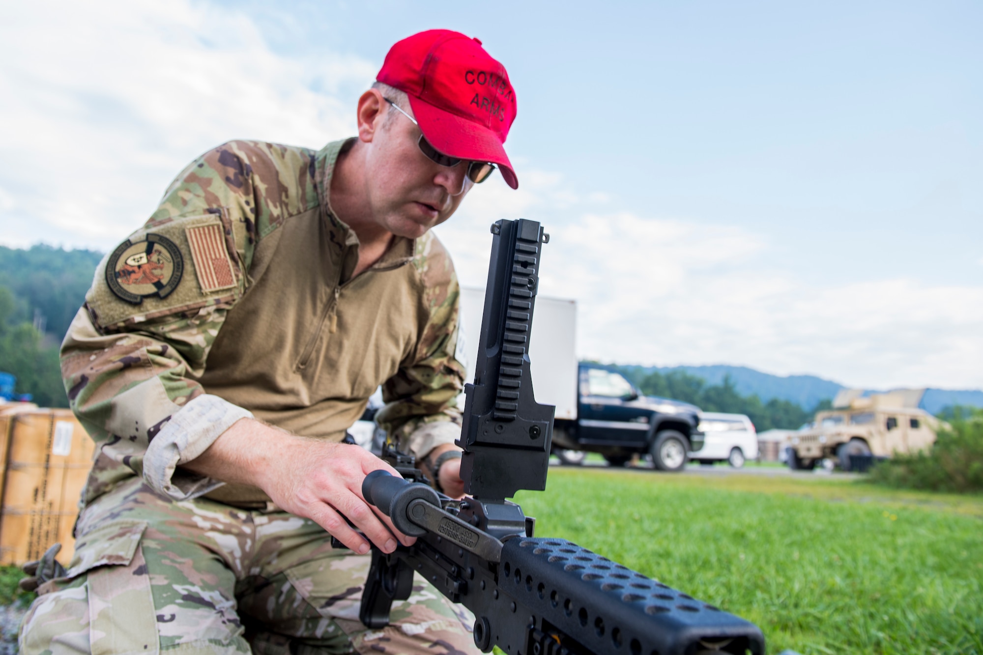 Master Sgt. Randal Levander, 911th Security Forces Squadron combat arms instructor, prepares a M240B machine gun to be fired at Camp Dawson, West Virginia, Aug. 11, 2020.