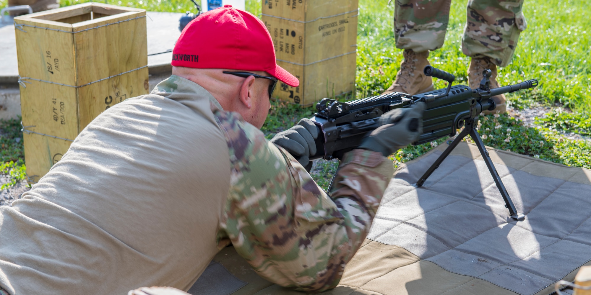 Technical Sgt. Joseph Duckworth, 911th Security Forces Squadron combat arms instructor, demonstrates how to operate the M249 light machine gun to fellow 911th SFS members at Camp Dawson, West Virginia, Aug. 11, 2020.