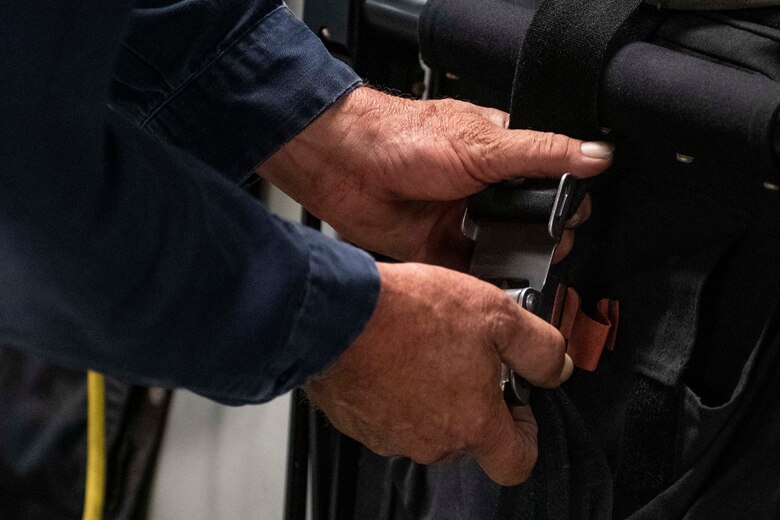 Aircraft attendants clean the inside of a C-17 Globemaster III.