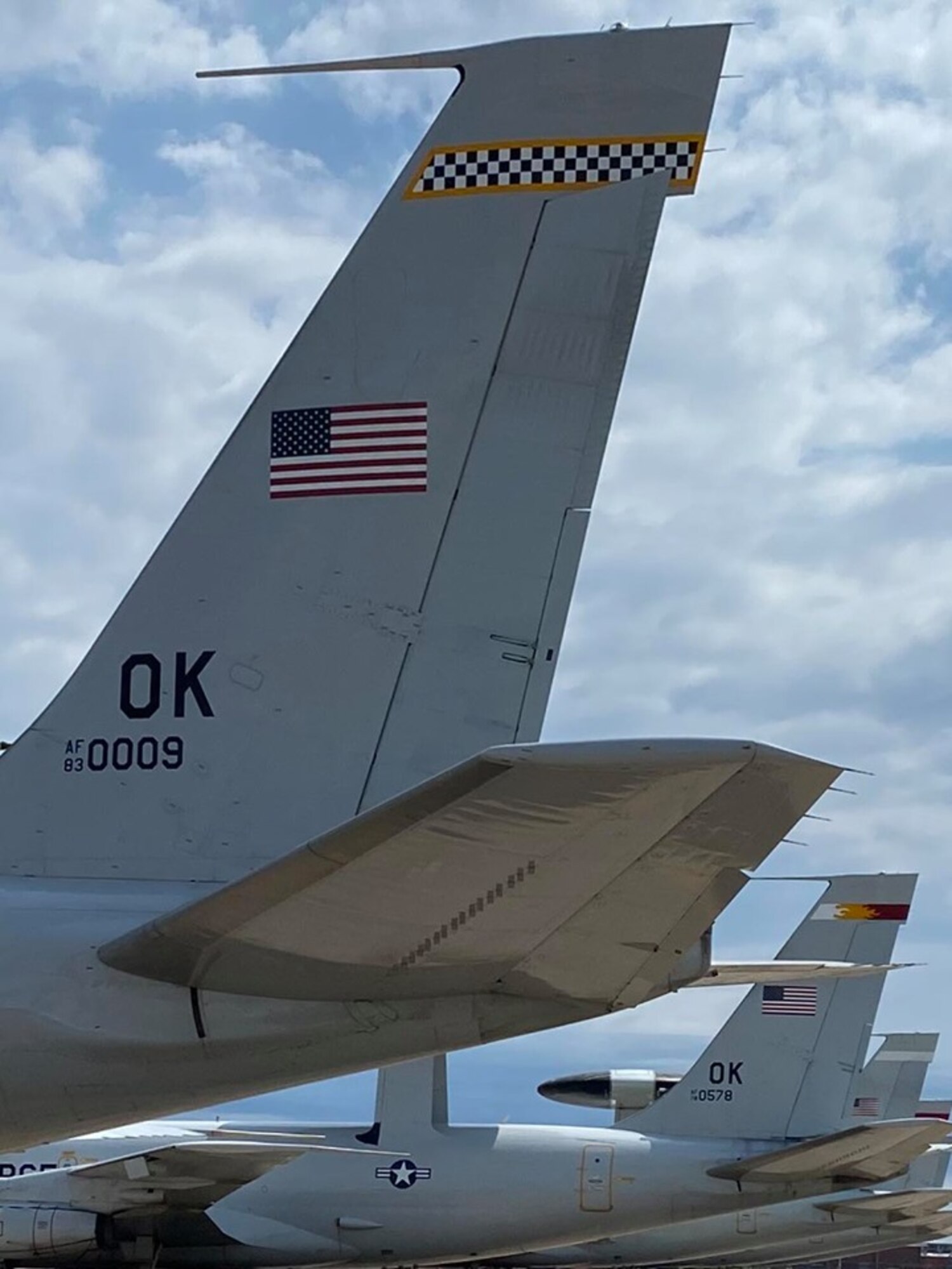 Two Airborne Warning and Control System aircraft from the 552nd Air Control Squadron receive new tail flashes at Tinker Air Force Base, Oklahoma. Aircraft 0009 represents the 963rd Airborne Air Control Squadron “Blue Knights” and Aircraft 0578 represents the 964th AACS “Phoenixes” (U.S. Air Force photo by 1st Lt. Ashlyn K. Paulson).