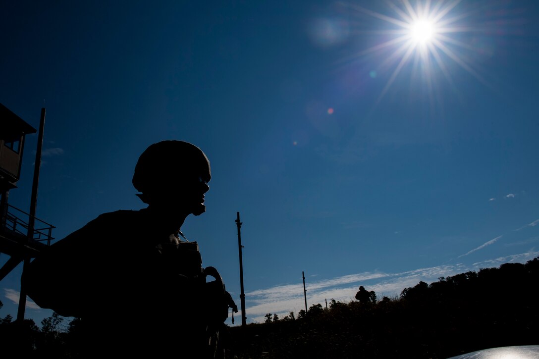 Senior Airman Andrew Hull, 911th Security Forces Squadron fire team member, waits for instructions from a combat arms instructor at Camp Dawson, West Virginia, Aug. 13, 2020.