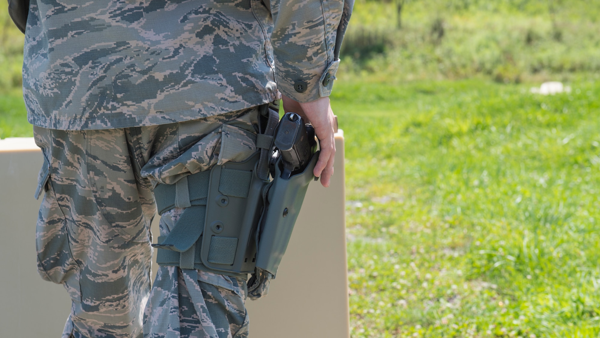 Senior Airman Andrew Hull, 911th Security Forces Squadron fire team member, prepares to fire an M9 pistol at Camp Dawson, West Virginia, Aug. 10, 2020.