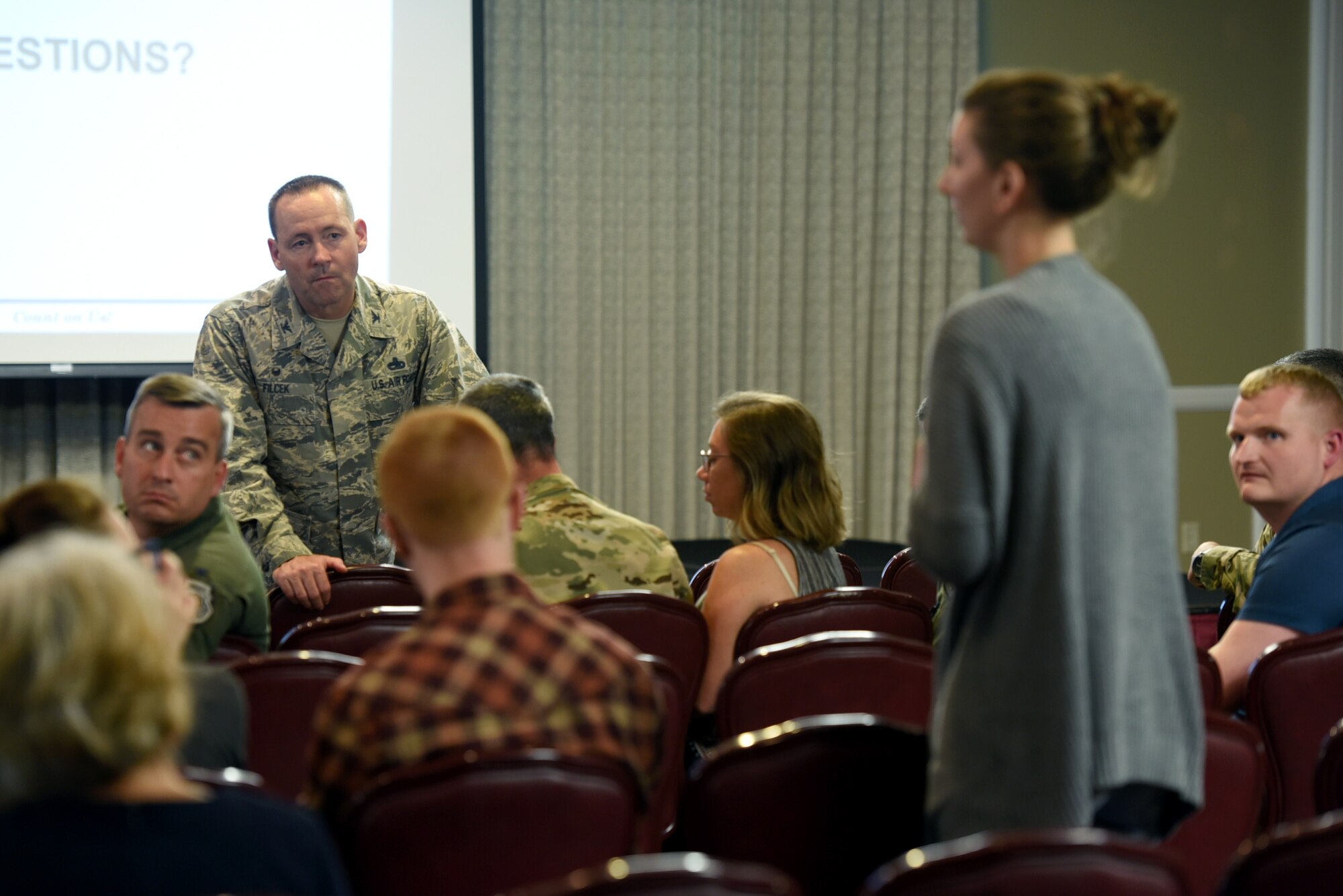 Col. Paul Filcek, 72nd Air Base Wing commander, talks to a housing resident at Tinker Air Force Base, Oklahoma,