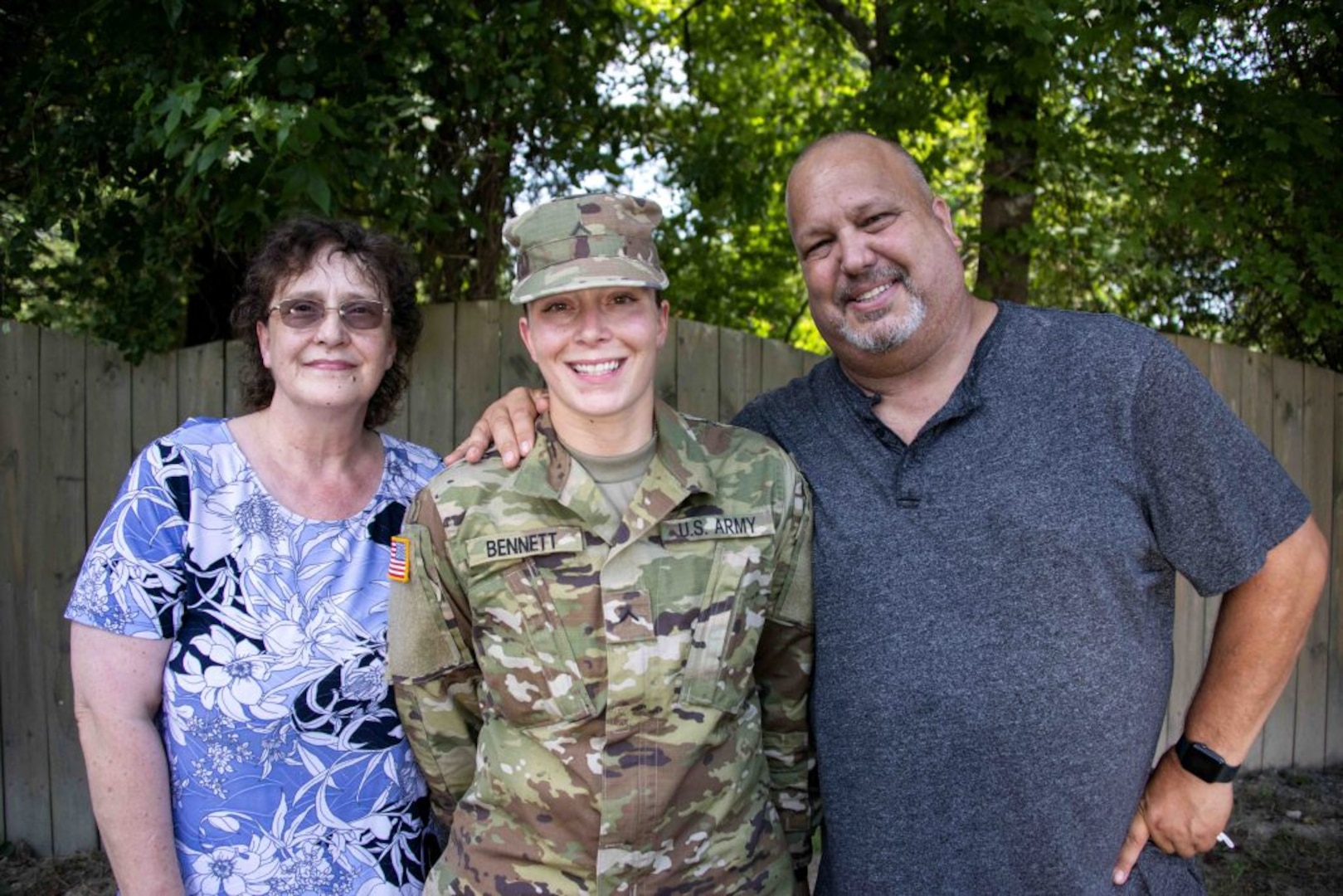 Pvt. Ana-Alicia Bennett poses for a photograph with her parents July 27, 2020, outside their home in Mechanicsville, Virginia.