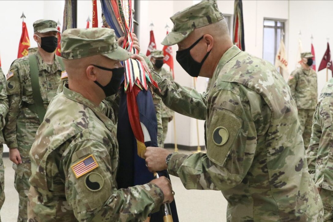 Col. Christopher J. Samulski takes command of the Staunton-based 116th Infantry Brigade Combat Team from Col. Joseph A. DiNonno July 31, 2020, at Fort Pickett, Virginia.