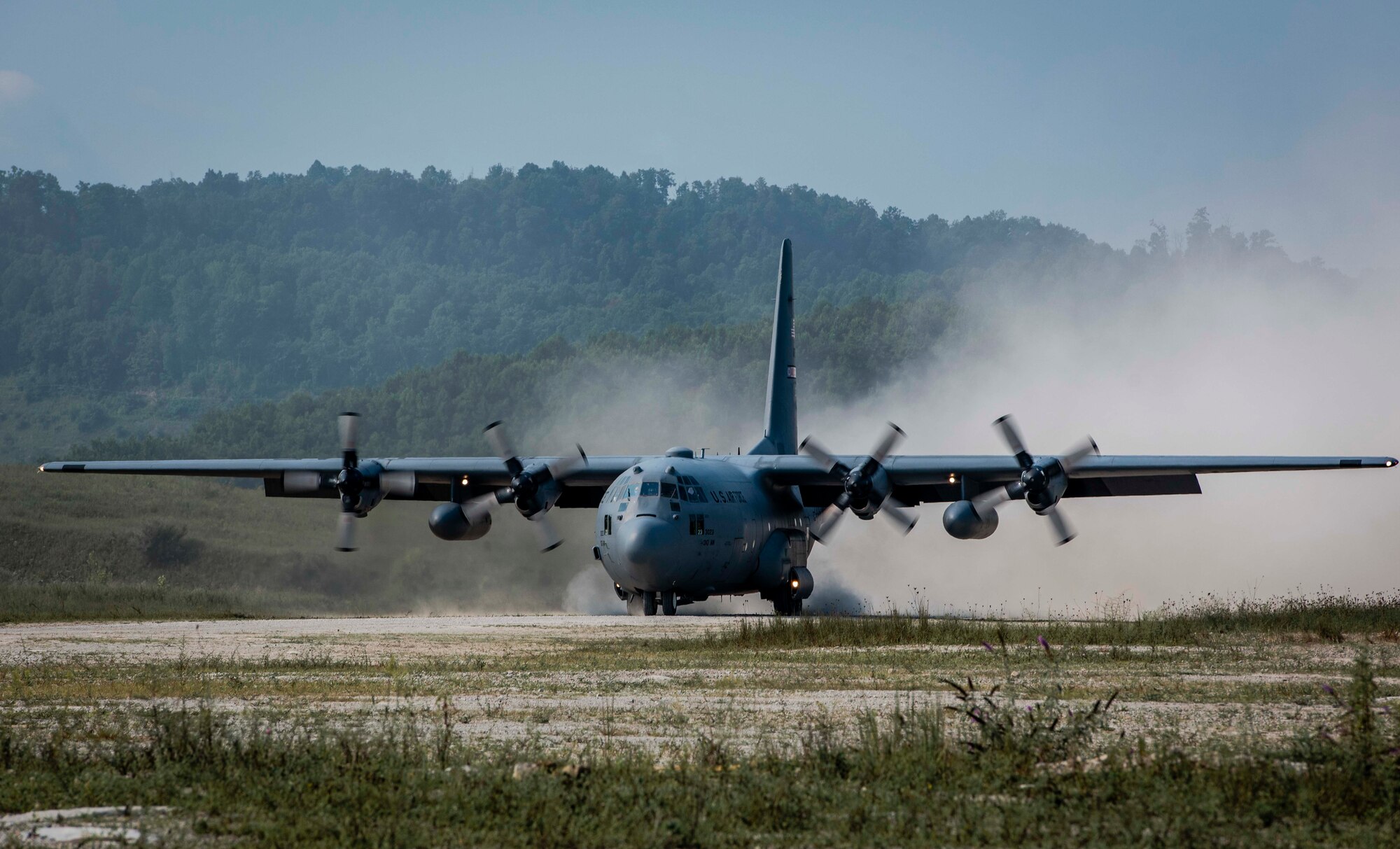 A U.S. Air Force Reserve aircrew from the 757th Airlift Squadron, Youngstown Air Reserve Station, Ohio, land a C-130H Hercules on a dirt landing zone during the distributed operations training event near Charleston, West Virginia, Aug. 25, 2020. The training event tested aircrew on their tactical combat airlift skills such as cargo airdrop, formation flights, and personnel delivery in a contested environment. There were a total of eight aircraft from various Reserve and Guard units supporting the training effort, enabling strategic depth and readiness for the force.