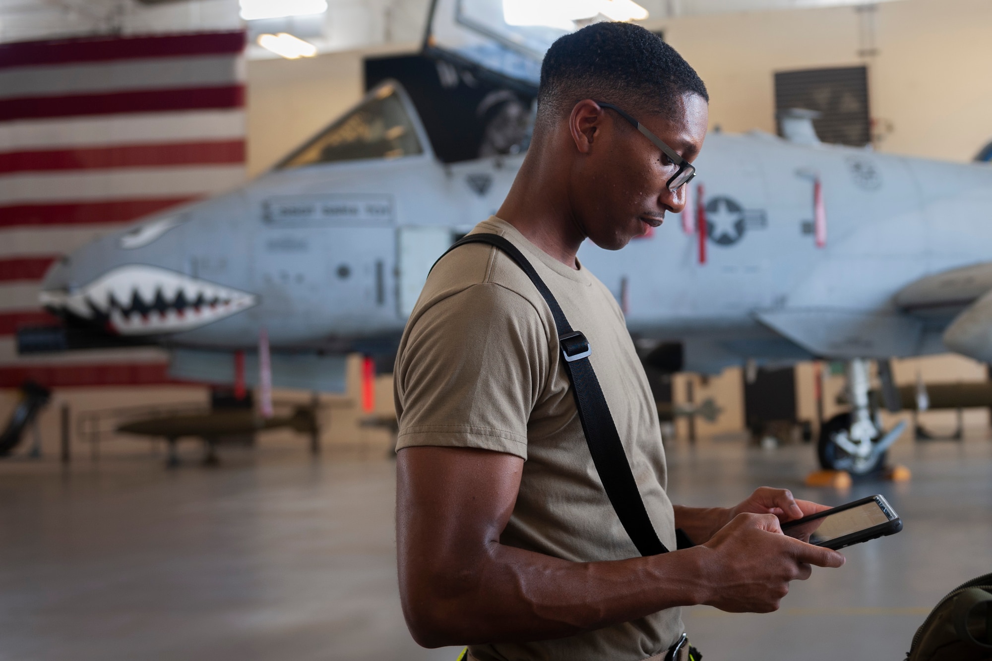 Photo of an Airman checking a technical order