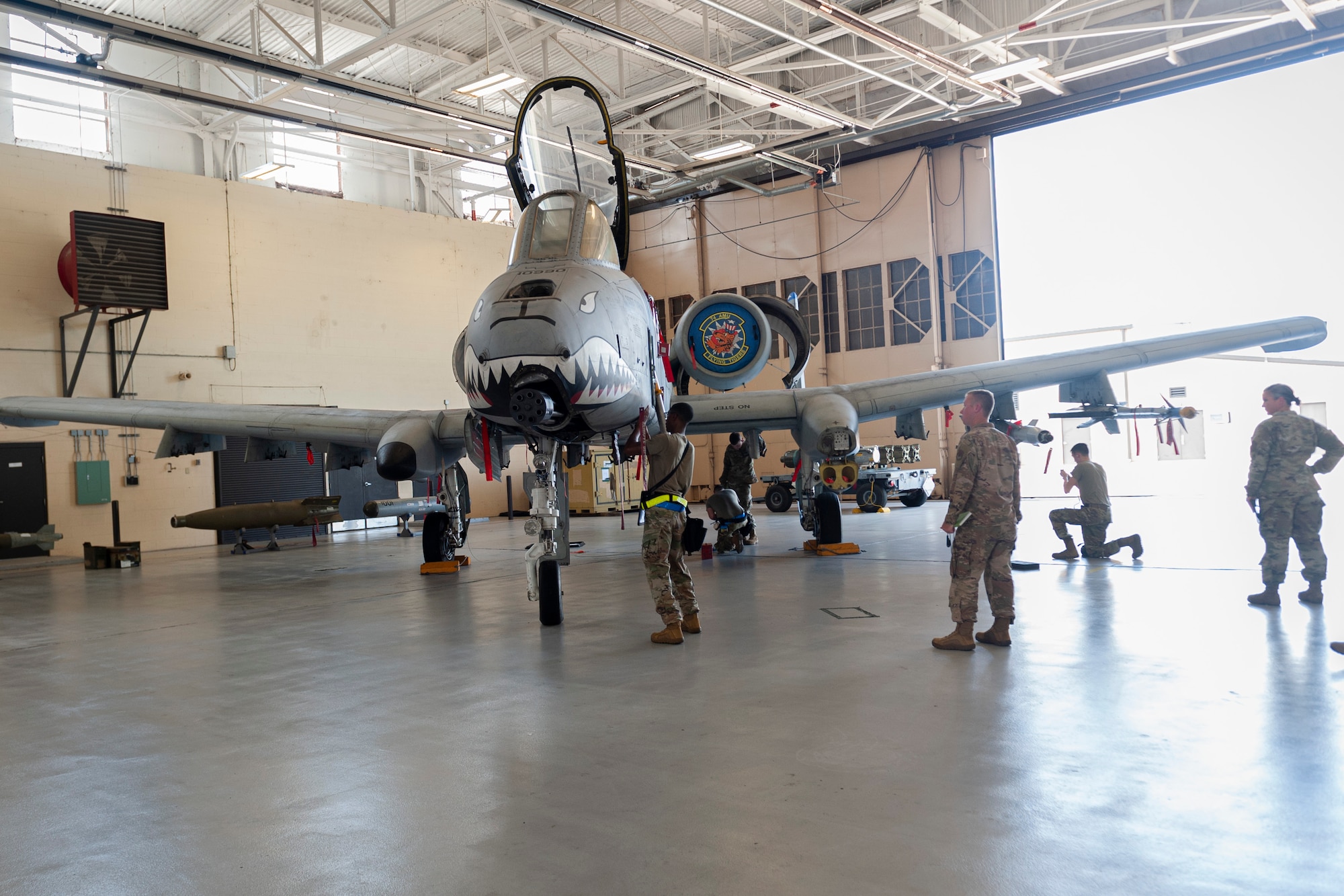 Photo of Airmen participating in a weapons load competition