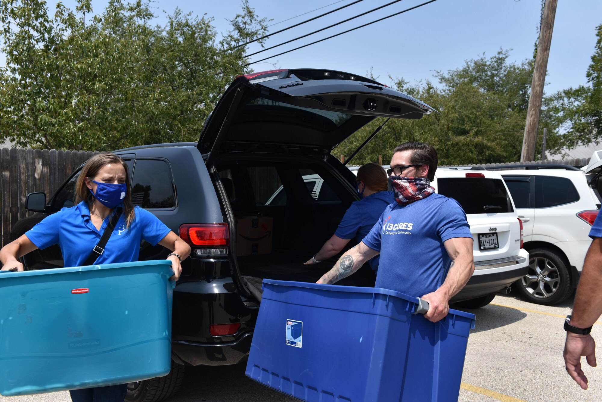 Individuals from Goodfellow Air Force Base unload donations for the Concho Valley Home for Girls in San Angelo, Texas, Aug. 21, 2020. Multiple squadrons and organizations donated various hygiene and sanitation supplies including: masks, toothbrushes, toothpaste, hand sanitizer and other needed supplies. (U.S. Air Force photo by Staff Sgt. Seraiah Wolf)