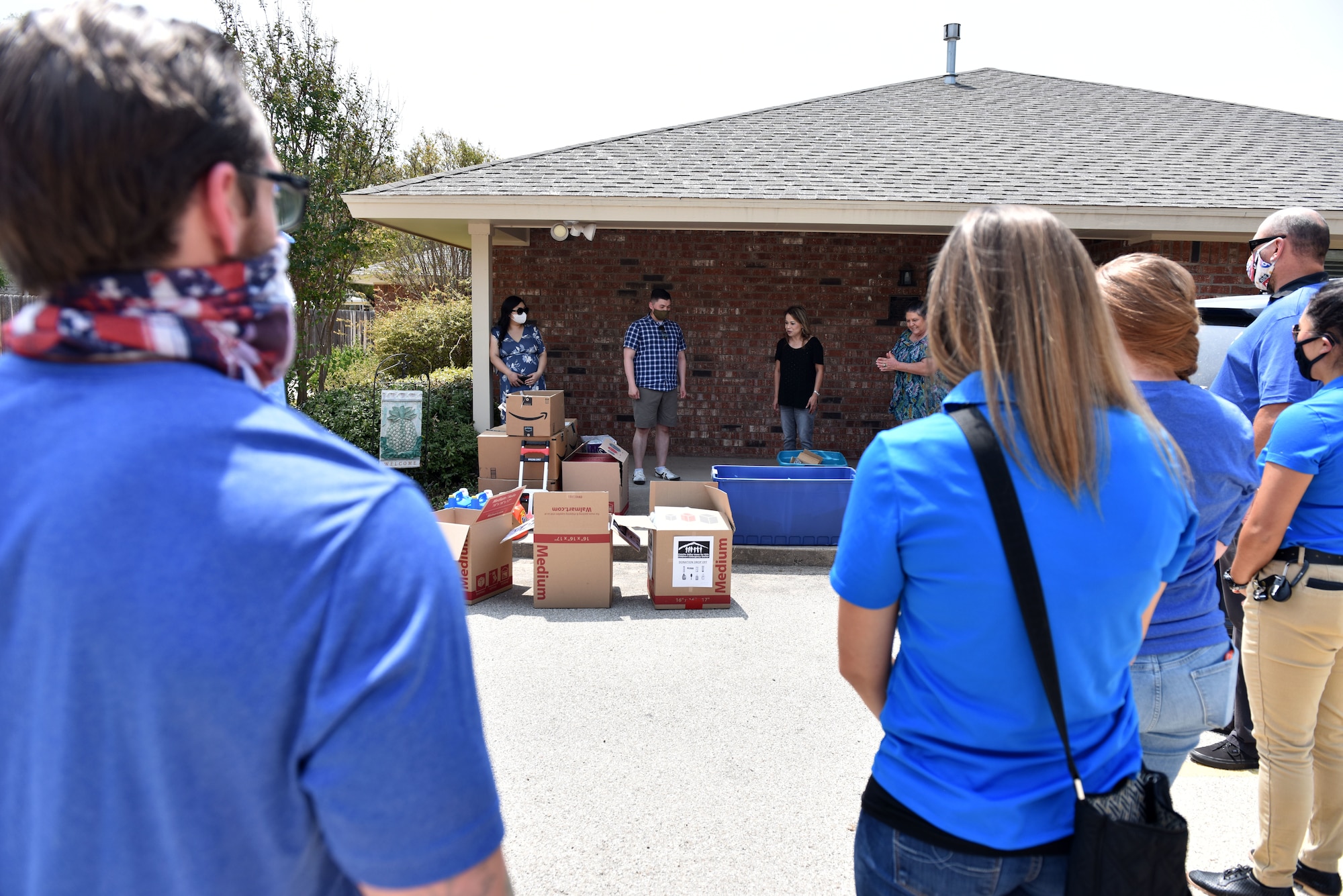 Volunteers from Goodfellow listen while staff members from Concho Valley Home for Girls thank them for their time and the donations in San Angelo, Texas, Aug. 21, 2020. Members from organizations across base gathered donations and took time out of their Friday to deliver the supplies. (U.S. Air Force photo by Staff Sgt. Seraiah Wolf)