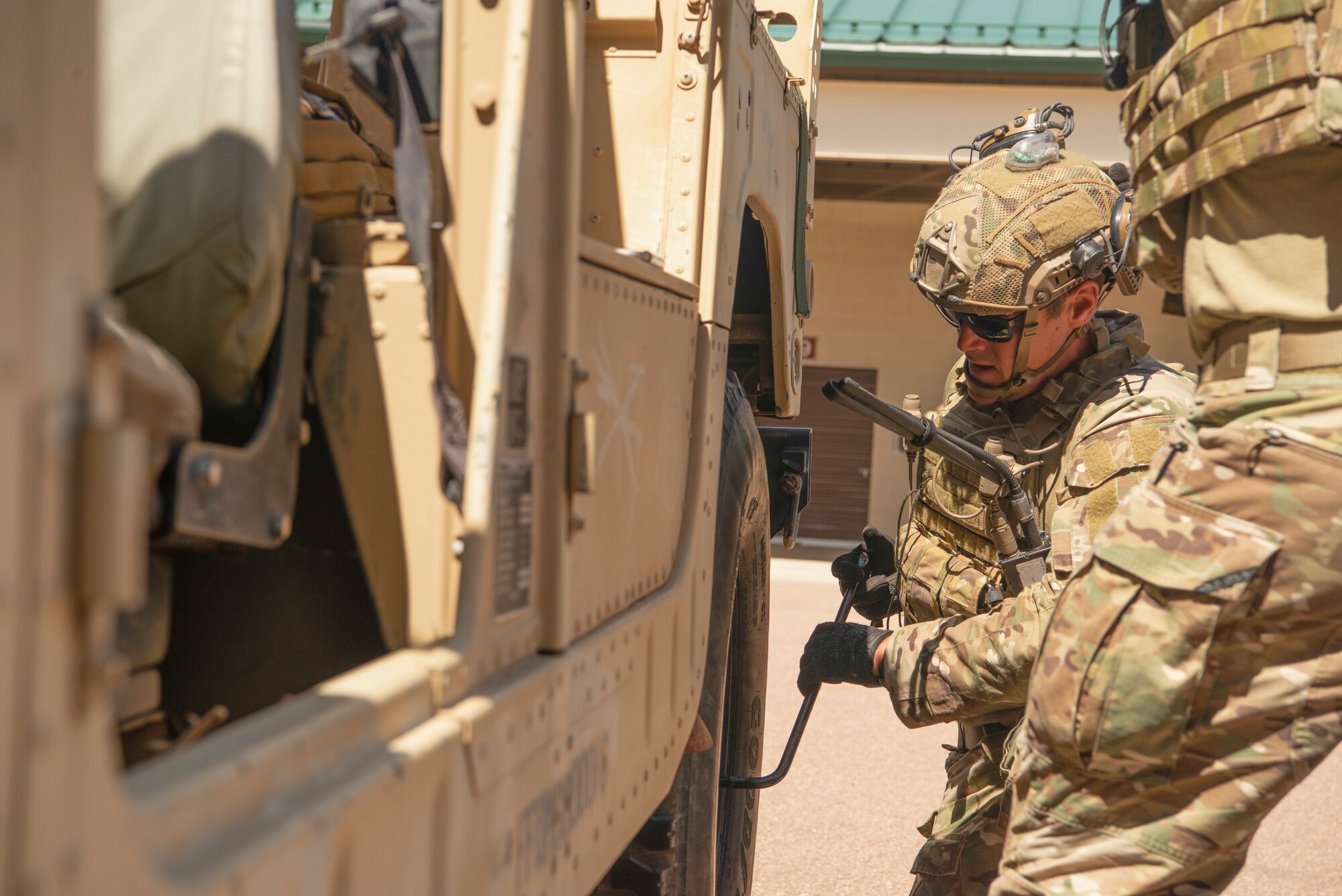 TACP's change Humvee tire