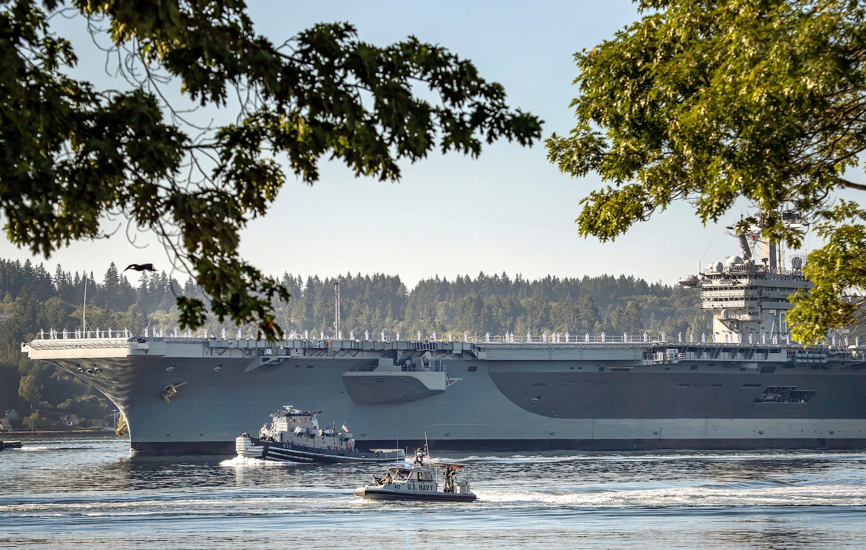 The USS Carl Vinson (CVN 70) makes its way past Point Herron Aug. 23, 2020 after departing Puget Sound Naval Shipyard & Intermediate Maintenance Facility in Bremerton, Washington. PSNS & IMF completed a docking planned incremental availability on Vinson Aug. 27, 2020, as the aircraft carrier completed sea trials enroute to San Diego, where it was homeported prior to its arrival at Naval Base Kitsap-Bremerton, Jan. 20, 2019.(PSNS & IMF photo by Scott Hansen)