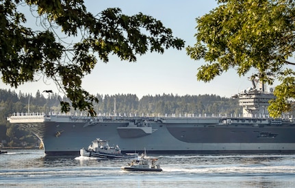 The USS Carl Vinson (CVN 70) makes its way past Point Herron Aug. 23, 2020 after departing Puget Sound Naval Shipyard & Intermediate Maintenance Facility in Bremerton, Washington. PSNS & IMF completed a docking planned incremental availability on Vinson Aug. 27, 2020, as the aircraft carrier completed sea trials enroute to San Diego, where it was homeported prior to its arrival at Naval Base Kitsap-Bremerton, Jan. 20, 2019.(PSNS & IMF photo by Scott Hansen)