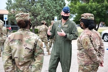 Colonel Michael Walters, 5BW Commander, speaks with Airmen about their thoughts on the new Welcome Center.  The 5th Bomb Wing held a ribbon-cutting ceremony to introduce a new Welcome Center facility August 21, 2020 at Minot Air Force Base, North Dakota.