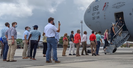 Local community members, line up to board a C-17 Globemaster III static display as part of a Leadership Charleston Tour at Joint Base Charleston, S.C., Aug 20, 2020. Members of Charleston organizations such as the Charleston Metro Chamber, encourage strengthening relationships between the community and military to support service members and their families, expanding the federal footprint in the region.