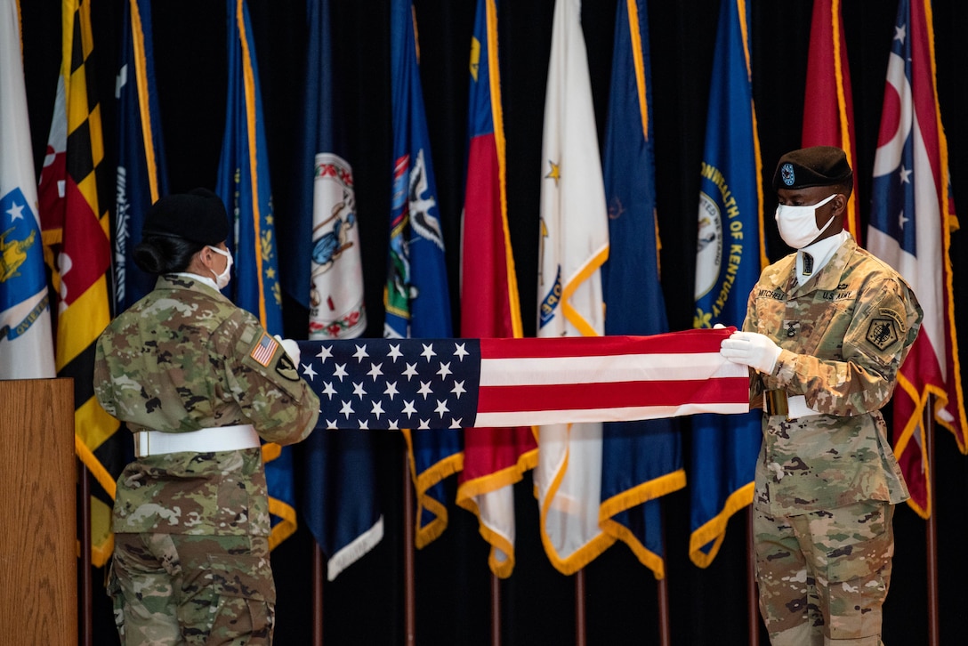 Soldiers fold the U.S. flag during the relinquishment-of-command and retirement ceremonies in honor of Maj. Gen. Steven W. Ainsworth, the outgoing commander of the 84th Training Command, Aug. 22, 2020, at Fort Knox, Ky.