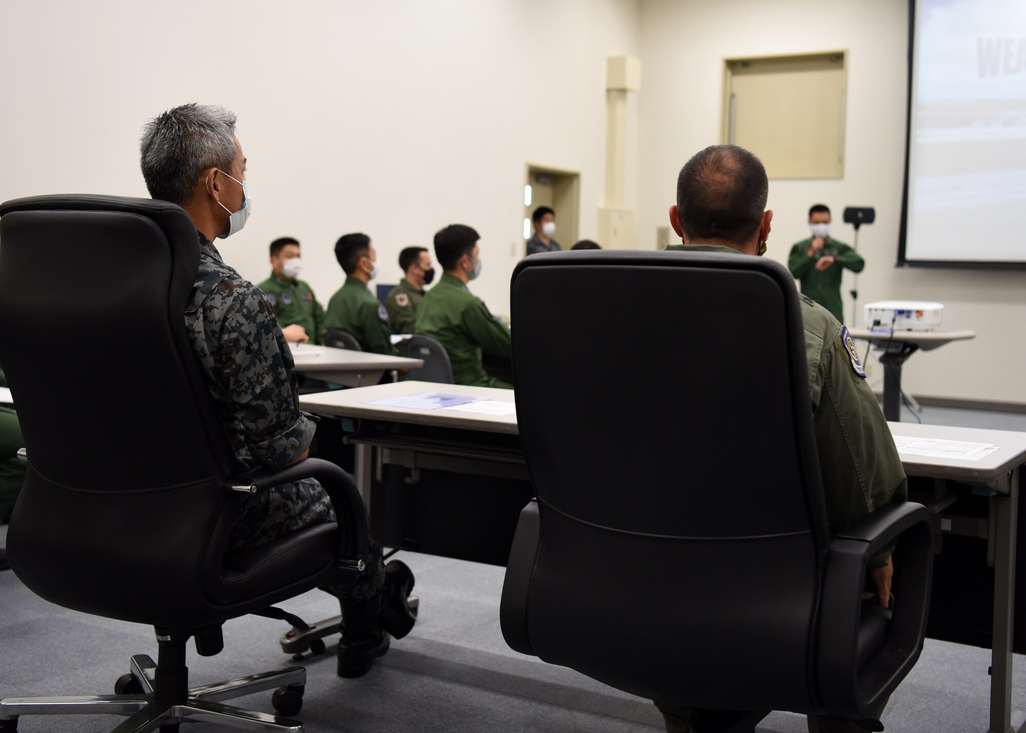 Individuals receive an indoor briefing