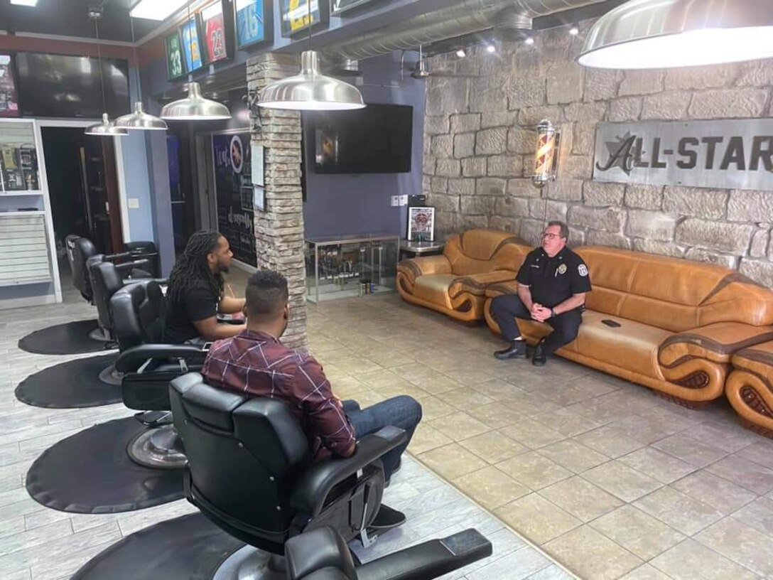 Will Taylor, left, a business owner, and Staff Sgt. Jarrod Peterson, center, a 72nd Test and Evaluation Squadron software engineer, talk with Chief Rich Lockhart, the Warrensburg, Missouri, Chief of Police, mid-June 2020, at Warrensburg, Missouri. Peterson and Lockhart met through Taylor. Together, they initiated the Community Forum which consist of local community representatives made up of key leaders from the Chamber of Commerce, City Manager, business owners and people from Whiteman Air Force Base (Courtesy Photo)