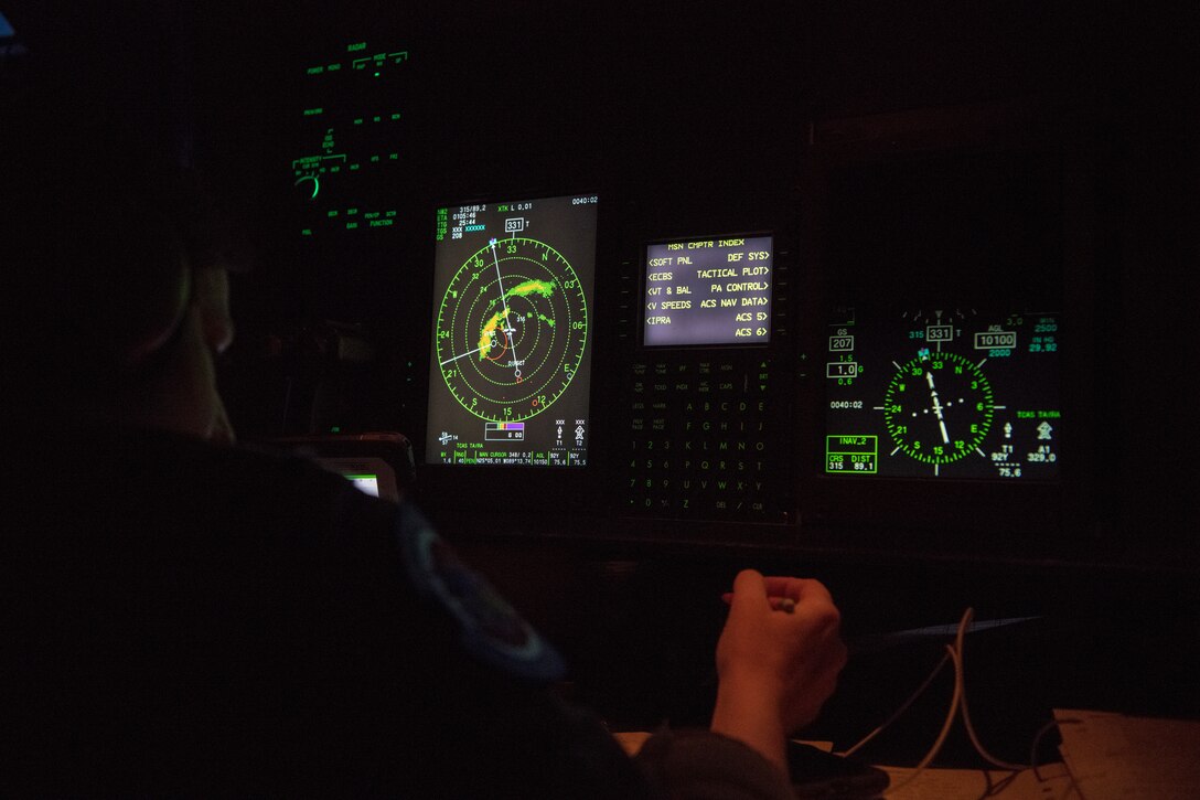 Capt. Julie Fantaske, a navigator for the 53rd Weather Reconnaissance Squadron, jots down notes during a flight into Hurricane Laura from Charleston International Airport, S.C. Aug. 25, 2020. The 53rd WRS operates out of Keesler Air Force Base, Miss., and plays an important role in the forecasting of tropical systems by flying directly into storms and collecting atmospheric data satellites cannot reach, improving the area of impact by up to 25 percent. (U.S. Air Force photo by Senior Airman Kristen Pittman)