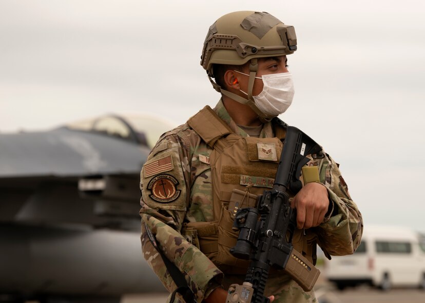 Individuals observe training in an outdoor environment