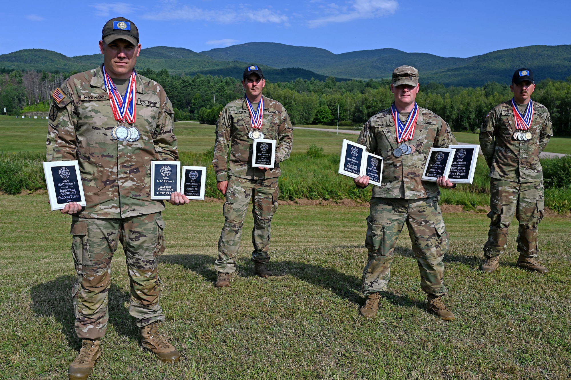 From left, Maj. Brooks Hayward, Staff Sgt. Joseph Wyner, Capt. Patrick Randall and Staff Sgt. David Musso show off their medals and plaques won at the 2020 Military Advisory Council Region 1 (MAC 1) shooting match on Aug. 23, 2020, at Camp Ethan Allen Training Site in Jericho, Vt.