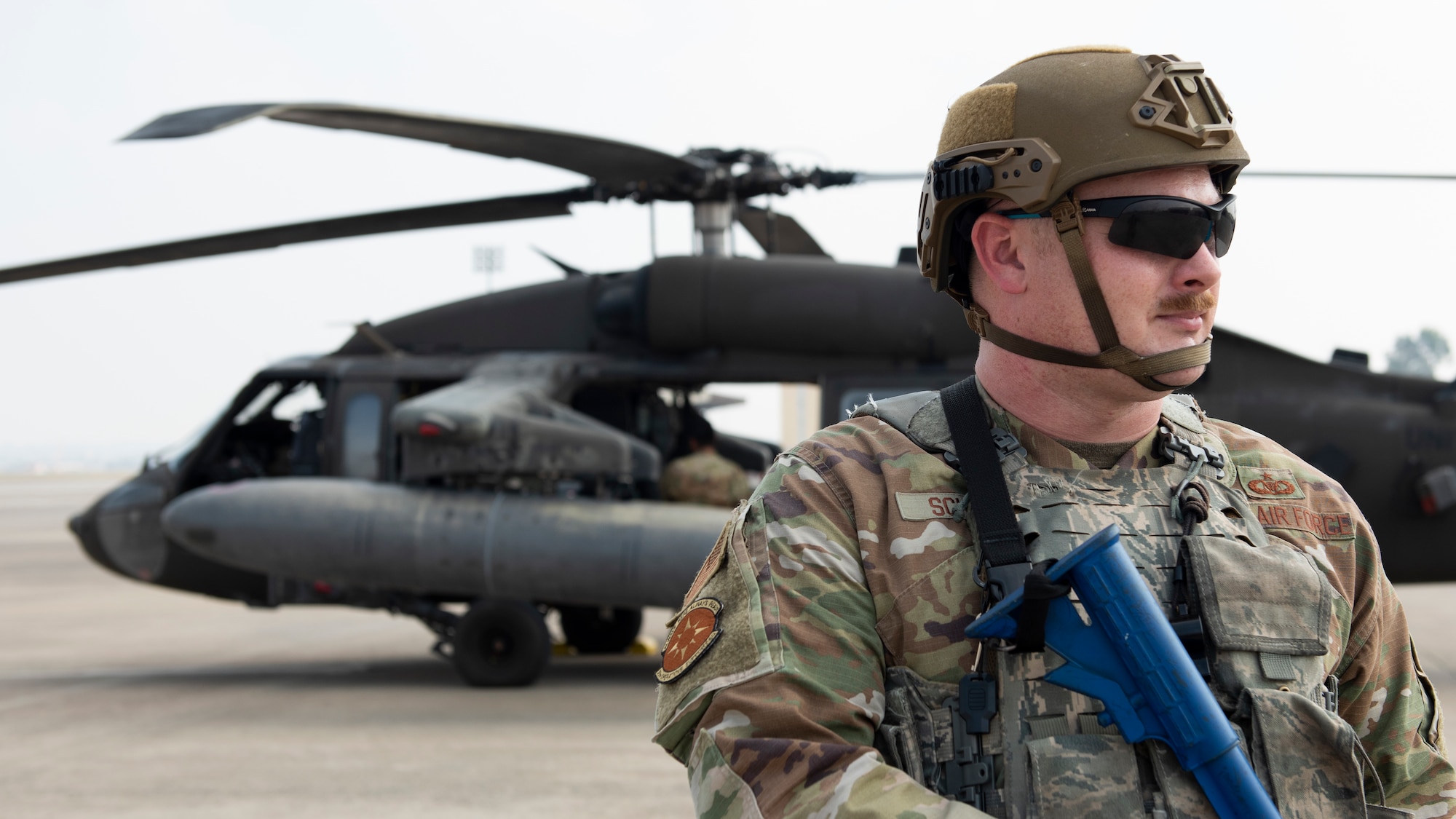 Airman guarding helicopter