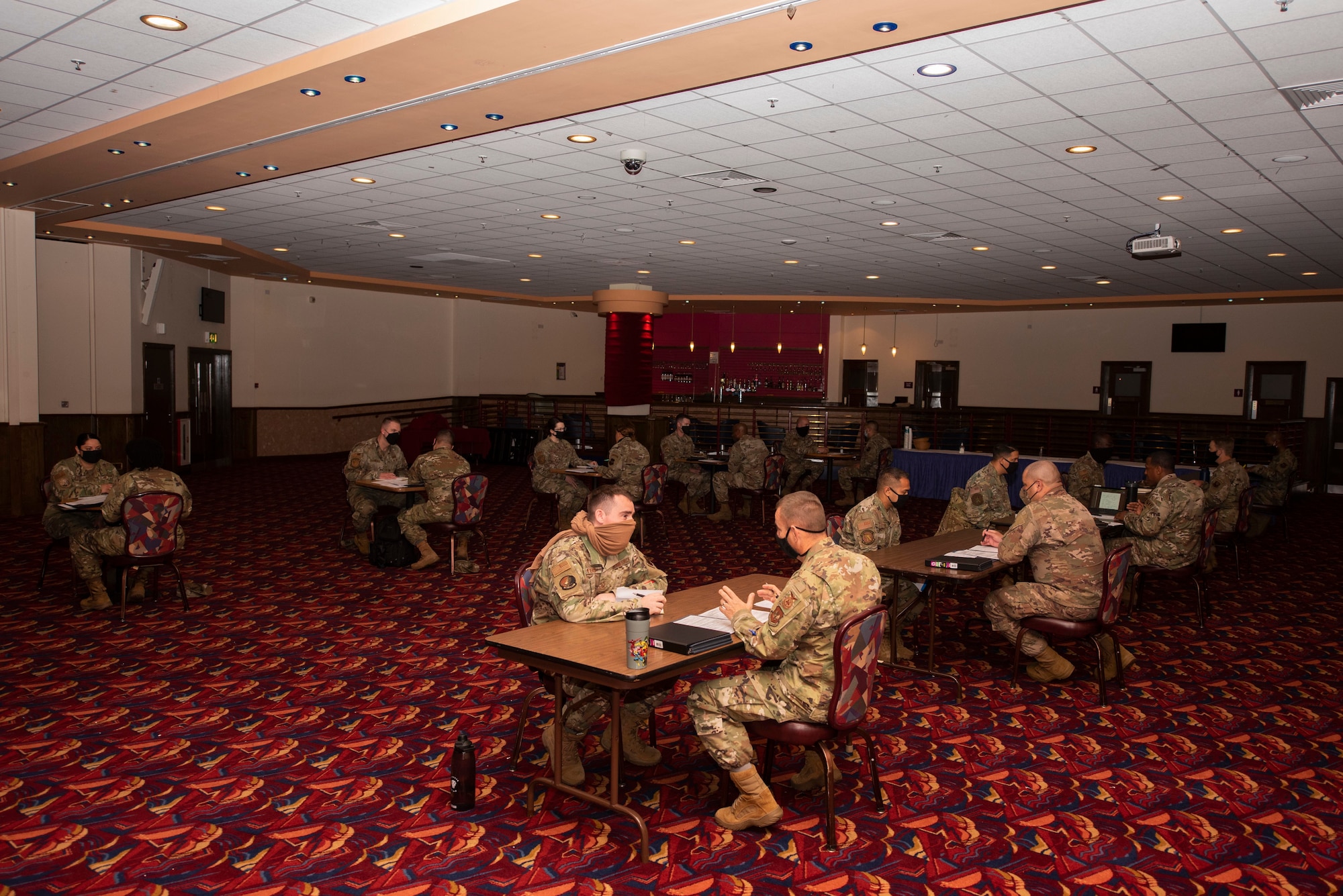 Chief master sergeants and senior master sergeants review the performance and career data briefs of technical sergeants as part of a mentorship board at Royal Air Force Mildenhall, England, Aug. 26, 2020. The mentorship board was organized by the Team Mildenhall Top III council to assist technical sergeants in understanding the skillsets necessary for leading at the highest tier of the enlisted force structure. (U.S. Air Force photo by Airman 1st Class Joseph Barron)