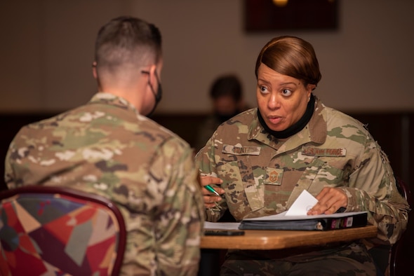 Chief master sergeants and senior master sergeants review the performance and career data briefs of technical sergeants as part of a mentorship board at Royal Air Force Mildenhall, England, Aug. 26, 2020. The mentorship board was organized by the Team Mildenhall Top III council to assist technical sergeants in understanding the skillsets necessary for leading at the highest tier of the enlisted force structure. (U.S. Air Force photo by Airman 1st Class Joseph Barron)