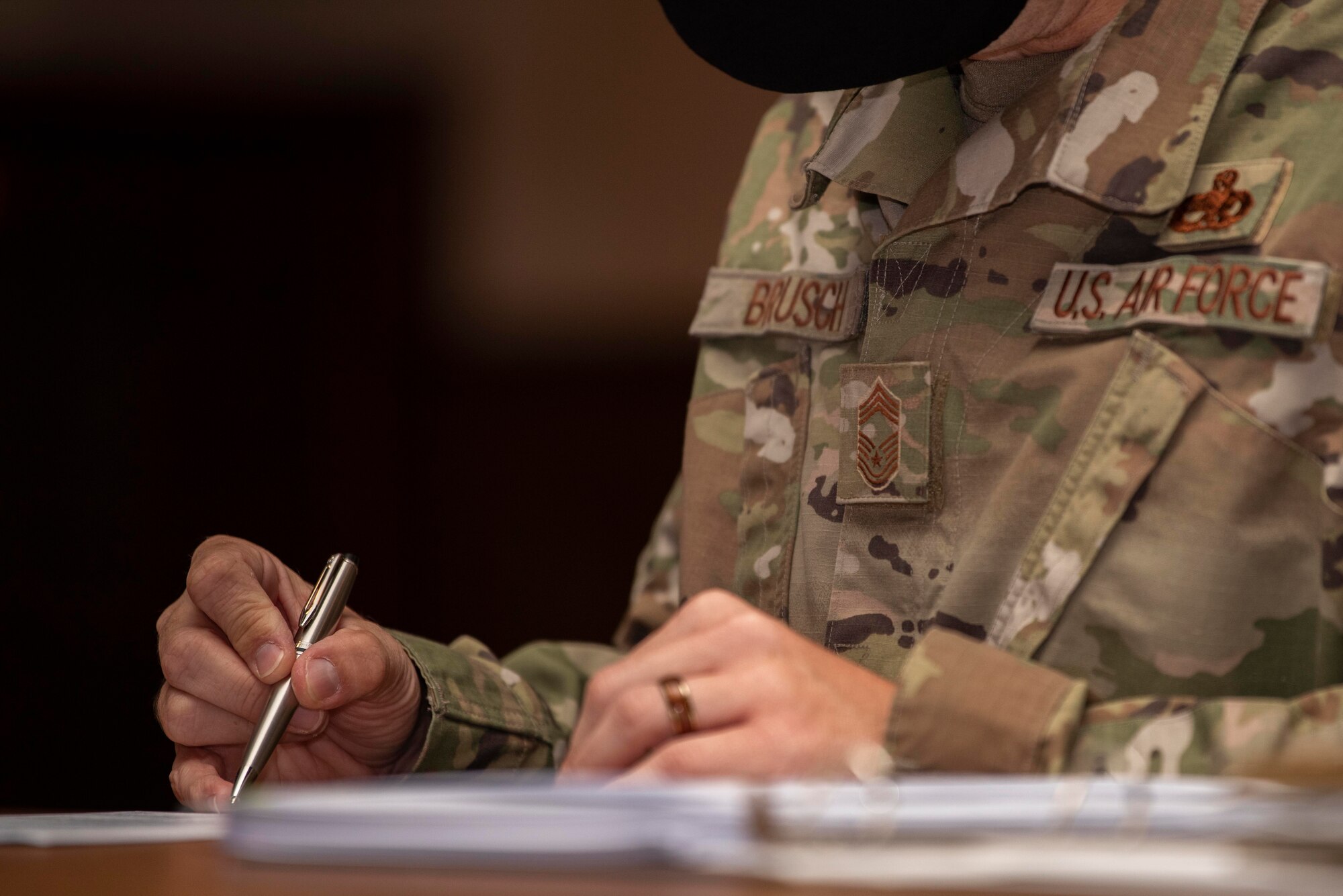 Chief Master Sgt. Colby Brusch, 752nd Special Operations Aircraft Maintenance Squadron superintendent, reviews the performance records of a technical sergeant during a mentorship board at Royal Air Force Mildenhall, England, Aug. 26, 2020. Technical sergeants took advantage of the knowledge of chief master sergeants and senior master sergeants to accelerate their journey of promoting to the rank of master sergeant. (U.S. Air Force photo by Airman 1st Class Joseph Barron)