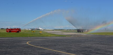 New York Army National Guard Chief Warrant Officer 4 James Sauer pilots his Army C-12 airplane through a salute wet down, concluding his final flight as an Army aviator Aug. 25, 2020. His flight caps a 40-year career and friends and family joined him as he arrived to celebrate at the Army Aviation Flight Facility in Rochester, N.Y.