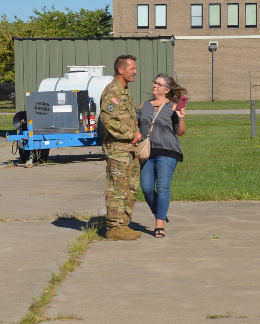 New York Army National Guard Chief Warrant Officer 4 James Sauer greets his wife, Marie, after concluding his final flight at as an Army aviator Aug. 25, 2020, capping a 40-year career. Friends and family joined him as he arrived to celebrate at the Army Aviation Flight Facility in Rochester, N.Y.
