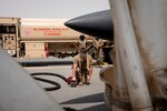 A U.S. Air Force mobile distribution operator from the 379th Expeditionary Logistics Readiness Squadron participates in an F-15E Strike Eagle hot refueling training scenario, Aug. 23, 2020, Al Udeid Air Base, Qatar. The 332nd conducted the training at Al Udeid in conjunction with a two-day U.S. Air Forces Central Command bi-lateral key leader engagement called the Qatar-AFCENT Friendship Event from Aug. 23 and 24, which brought together members of the 379th AEW and the 332nd AEW with the Qatar Emiri Air Force for an F-15E familiarization flight. (U.S. Air Force photo by Tech. Sgt. Michael Battles)