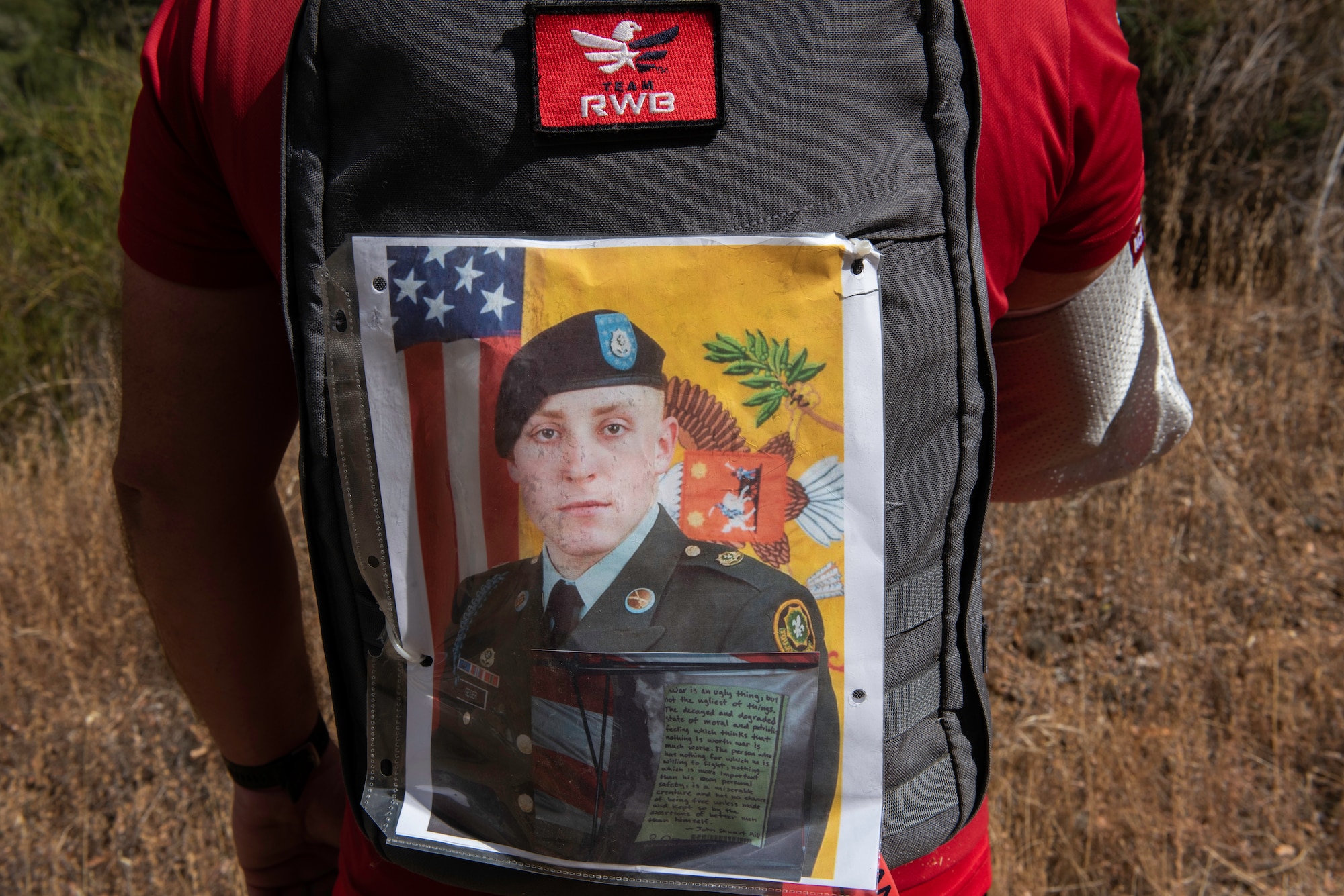 U.S. Air Force veteran Chris Coffelt, displays a photograph of U.S. Army Spc. Wayne Geiger, on his rucksack Aug. 16, 2020, in Auburn, California. Geiger was killed in action Oct. 18, 2007, while supporting Operation Iraqi Freedom. Coffelt completed an 11-mile hike while carrying about 25 pounds to honor Geiger as part of the annual Gold Star Families Ruck March. (U.S. Air Force photo by Tech. Sgt. James Hodgman)