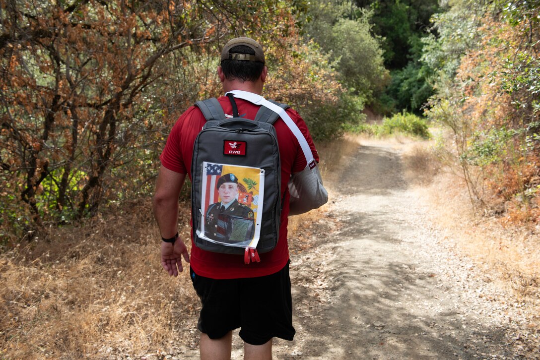 U.S. Air Force veteran Chris Coffelt, hikes along the Middle Fork American River Quarry Trail Aug. 16, 2020, in Auburn, California. Coffelt is participating in the Gold Star Families Ruck March, an annual event to honor gold star families and fallen service members. He dedicated the 11-mile hike to U.S. Army Spc. Wayne Geiger, who died Oct. 18, 2007 in Iraq. (U.S. Air Force photo by Tech. Sgt. James Hodgman)