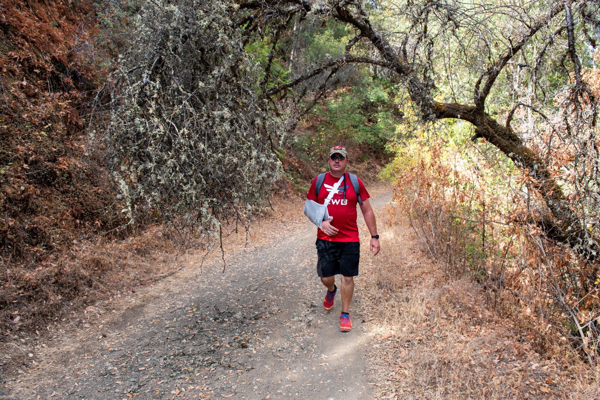 U.S. Air Force veteran Chris Coffelt, hikes along the Middle Fork American River Quarry Trail Aug. 16, 2020, in Auburn, California. Coffelt is participating in the Gold Star Families Ruck March, an annual event to honor gold star families and fallen service members. He dedicated the 11-mile hike to U.S. Army Spc. Wayne Geiger, who died Oct. 18, 2007 in Iraq. (U.S. Air Force photo by Tech. Sgt. James Hodgman)