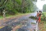 VNG Soldiers clear debris in Onancock following storm