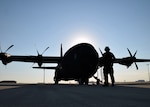 Staff Sgt. Zachary Faith, 403rd Aircraft Maintenance Squadron crew chief, performs a pre-flight check on a C-130J Hercules cargo aircraft Aug. 25 at Joint Base San Antonio-Lackland. Eight C-130Js evacuated from Keesler Air Force Base, Mississippi, to avoid damage from Hurricane Marco and Tropical Storm Laura.