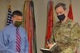 David C. Dusterhoff, deputy chief of staff, 1st Theater Sustainment Command, reviews upcoming tasks with Maj. Owen Koch, force management officer, at Fort Knox, Kentucky, Aug. 19, 2020. With more than 30 years of total federal service to draw upon, Dusterhoff uses this experience to manage daily operations within the 1st TSC. (U.S. Army Photo by Sgt. 1st Class Noel Gerig, 1st TSC Public Affairs)