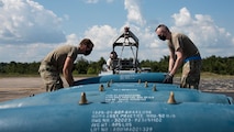 A photo of Airmen building bombs
