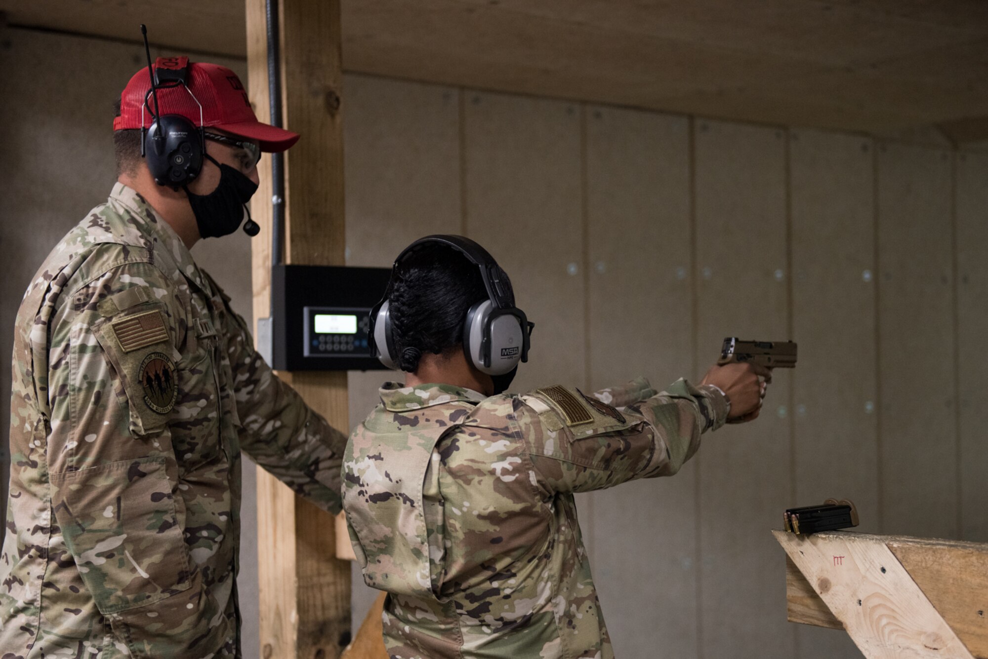 U.S. Air Force Chief Master Sgt. Melvina Smith, 8th AF command chief, receives training on the M18 Modular Handgun System during a base familiarization and immersion tour at Whiteman Air Force Base, Missouri, Aug. 25, 2020. Smith met with Airmen and leadership across base to discuss Team Whiteman’s role in the global strike and deterrence mission. (U.S. Air Force photo by Airman 1st Class Christina Carter)